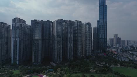 high rise buildings, river and city skyline with container barges on the river