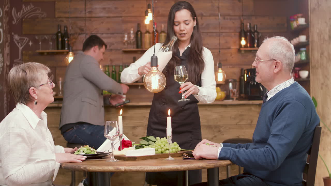 Couple enjoying a romantic dinner with wine in a restaurant