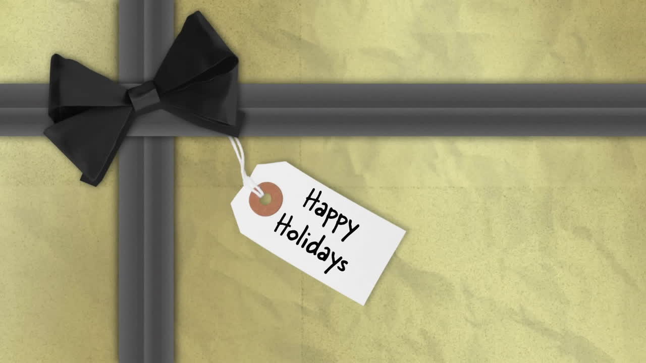 Happy Holidays text on gift tag with black bow animation