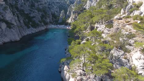 aerial drone shot flying over the calanque d'en vau in south of france.
