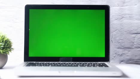 laptop with a green screen