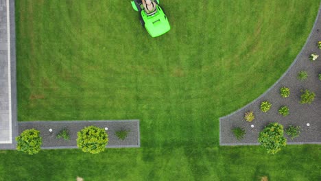 aerial view of man on tractor lawn mower.