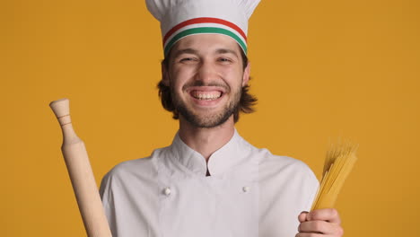 caucasian man in front of camera on yellow background.