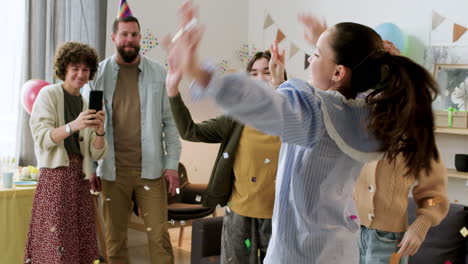 children throwing confetti and jumping