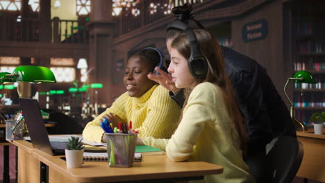 students learning together in a library setting