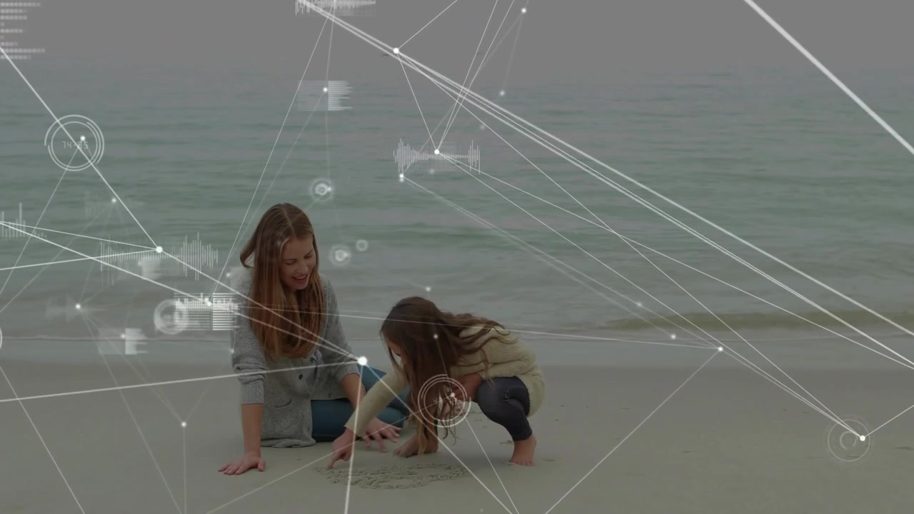 Child drawing wet sand and activating HUD network overlaying scene while guardian guiding learning