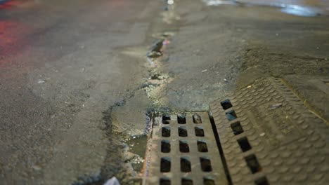 city street drain at night