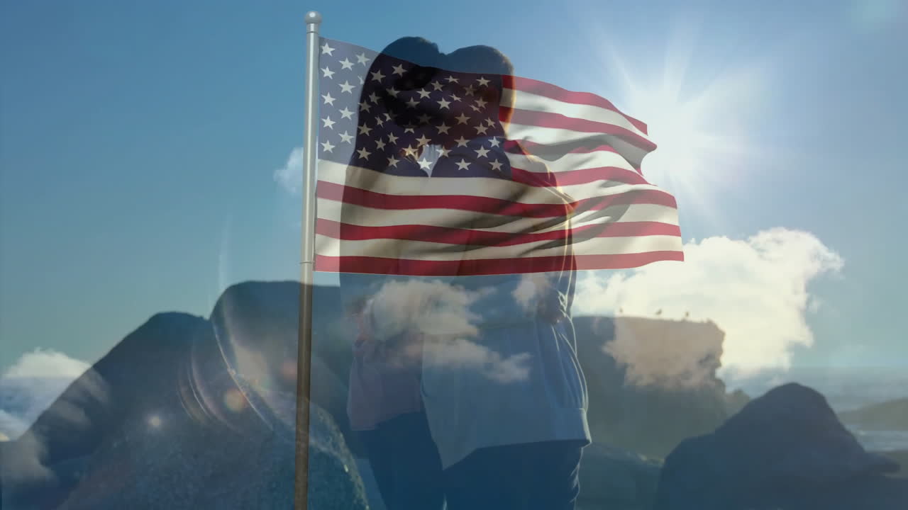 Under waving American flag, couple embracing outdoors on sunny day, feeling united