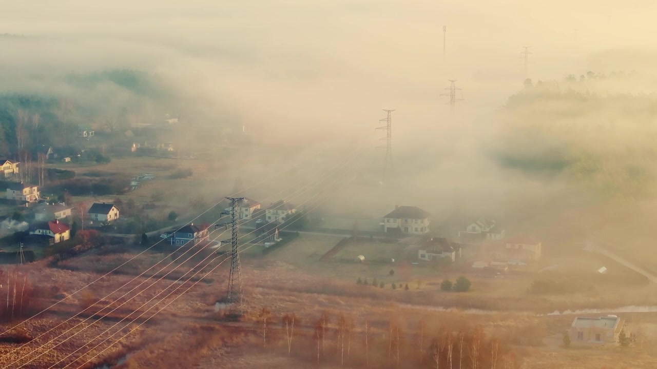 Drone turns right over Varkali as dense morning fog covers homes and power lines