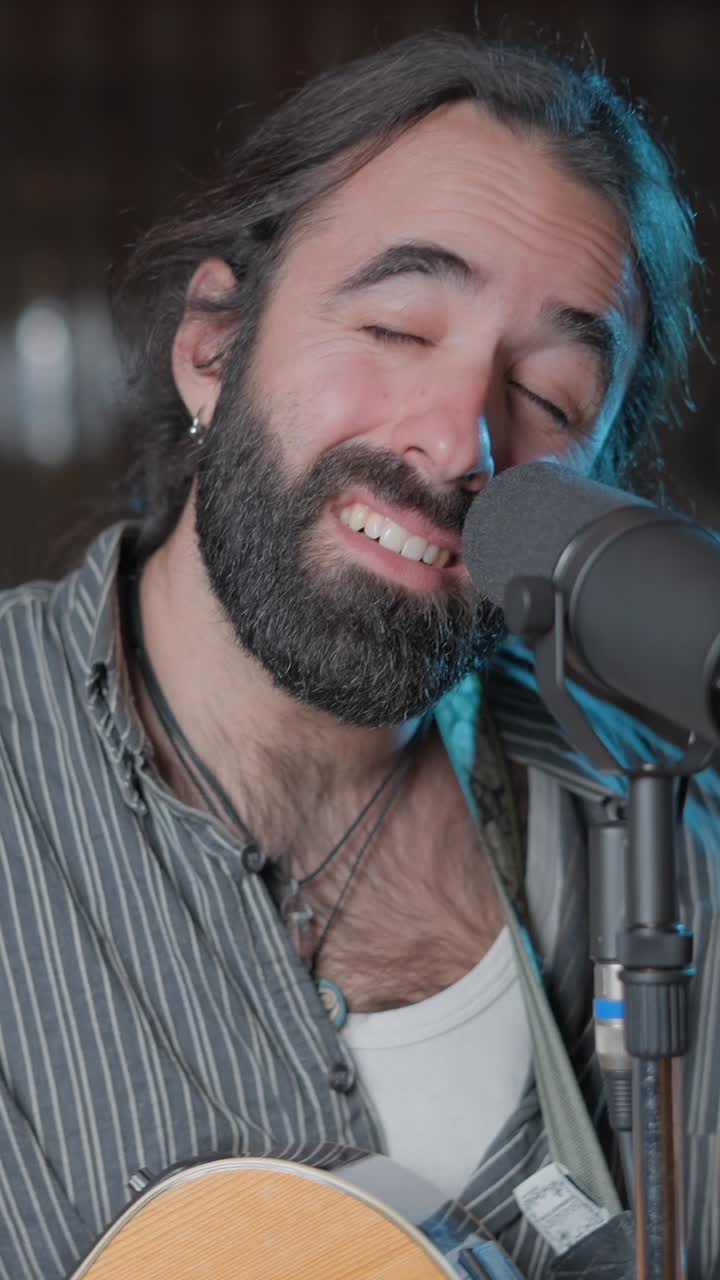 Passionate Male Musician Singing into Microphone