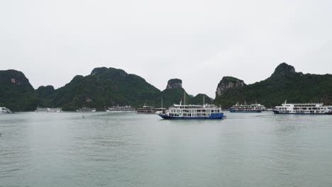 floating luxury cruise ships on the paradise sea of ha long bay in vietnam