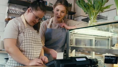 Down-syndrome-girl-learning-how-to-use-a-cash-register