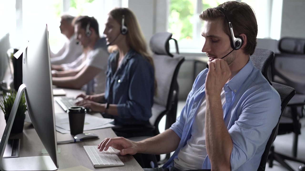 Customer Service Representative Working in a Busy Office
