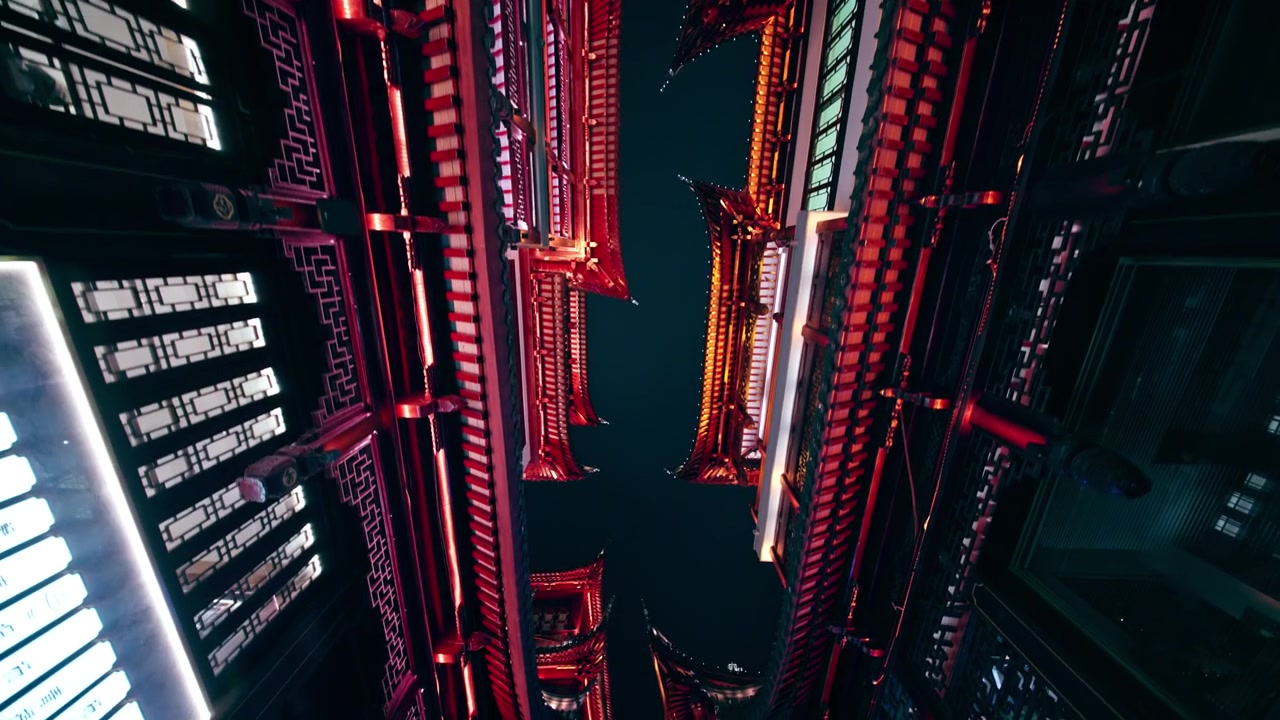 A striking upward perspective of red-lit traditional architecture in Shanghai, capturing intricate roof designs against the night sky. Ideal for cultural documentaries or travel features.