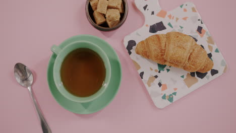 breakfast with croissant and tea