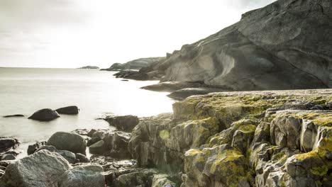 Beautiful-calm-waves-by-the-rocky-shoreline--time-lapse