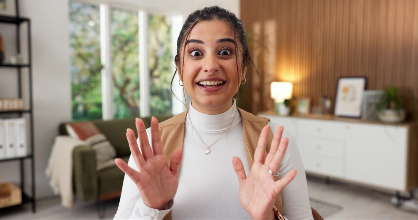 Young Woman Talking and Gesturing During a Video Call