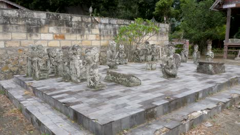 ancient stone chessboard with cultural statues in indonesia, outdoor, daylight