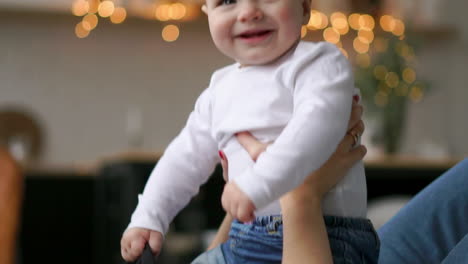 the best moments from life, a loving happy young mother hugs a nursing son, on a snow-white blanket, on a white background. concept of love, family, and happiness concept: children, kids, baby, babies