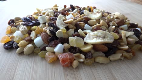 Eating-Dry-Nuts-on-Wooden-Table