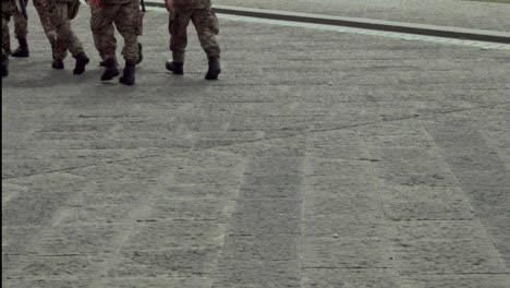 military team walking in the city detail of the legs