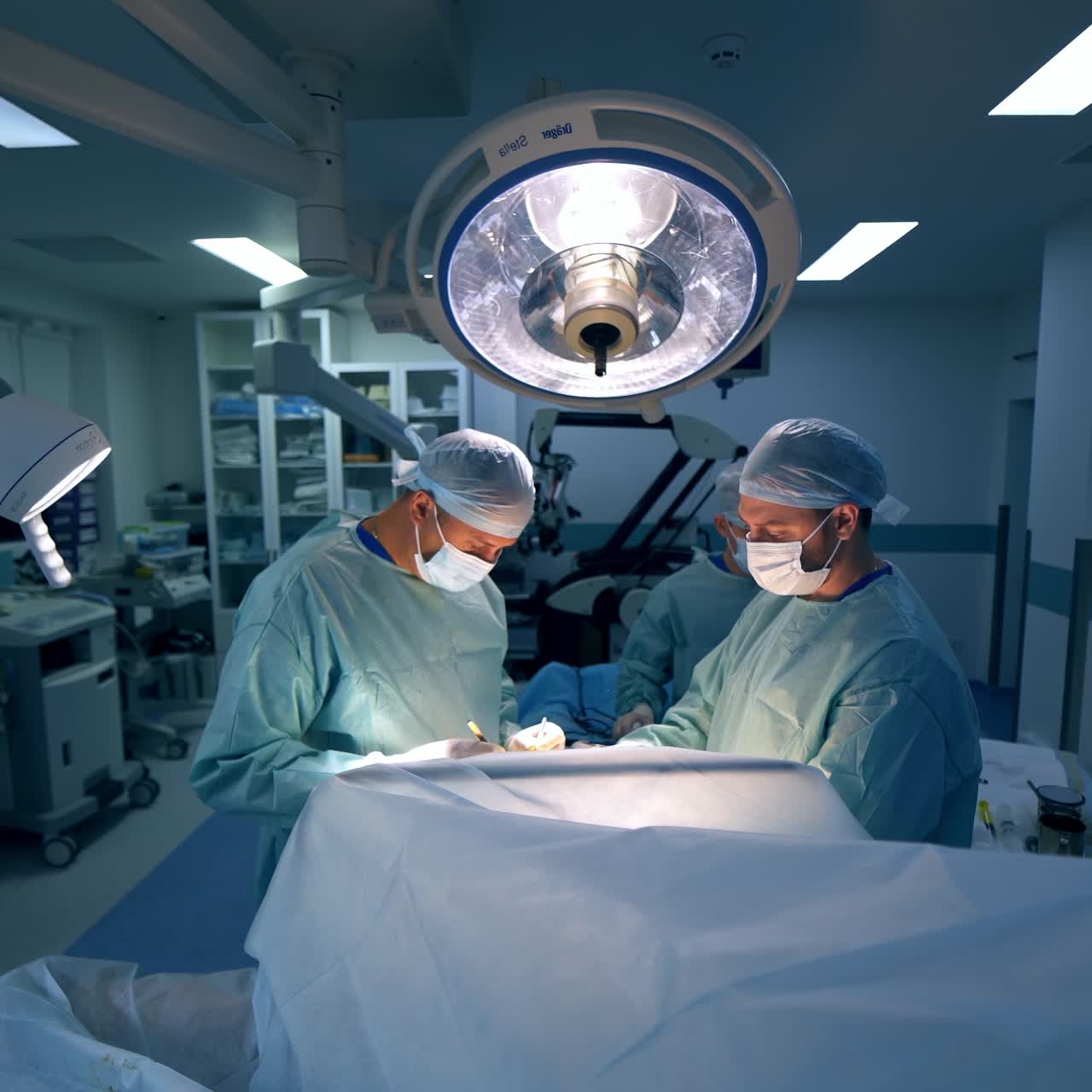 Modern plastic specialists working in surgery room. Professional medical specialists of plastic operation