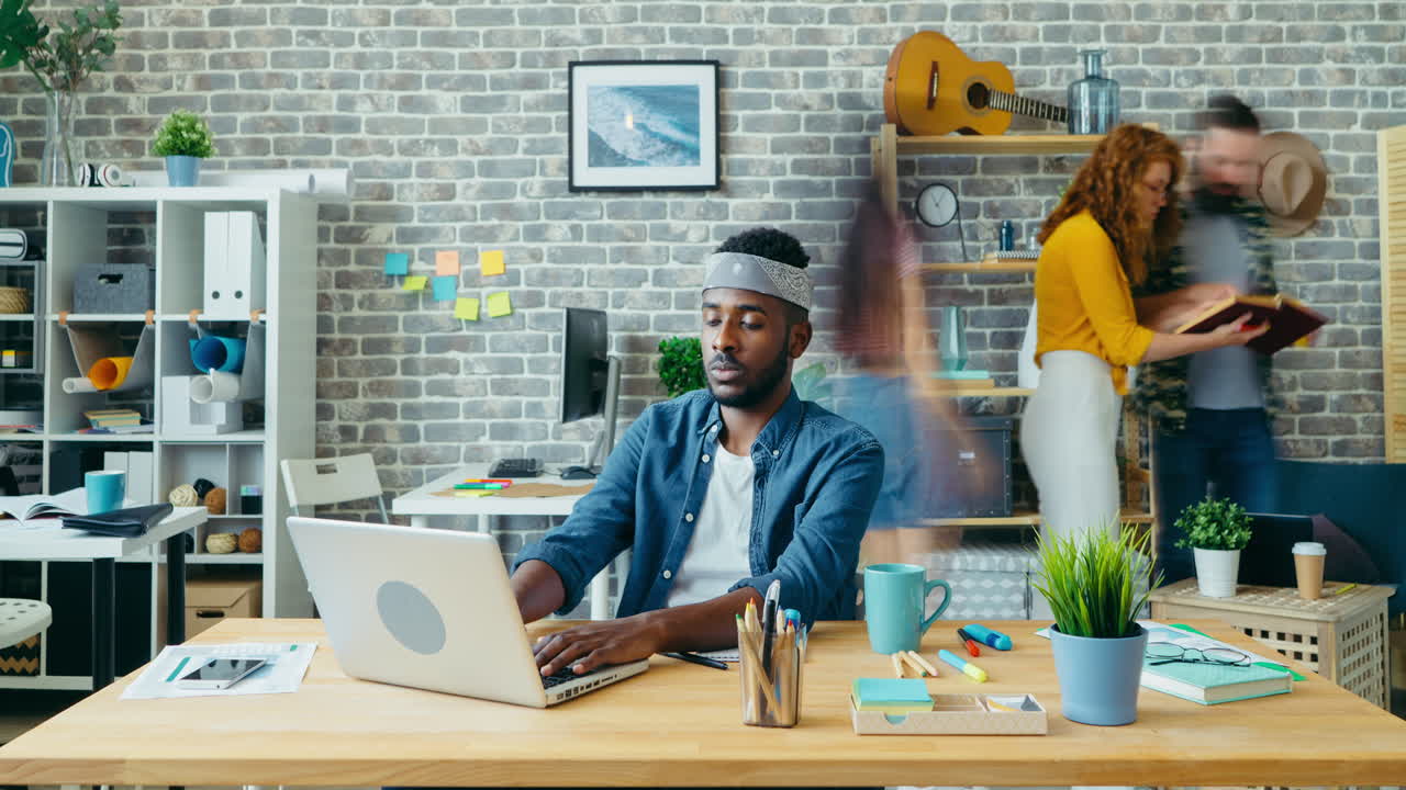 Busy office scene with diverse team