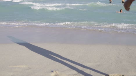 Cheerful-girl-walking-on-beach