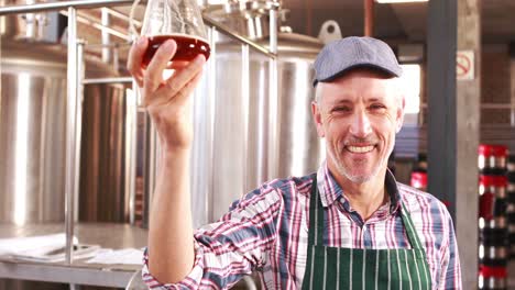 brewery worker checking the product