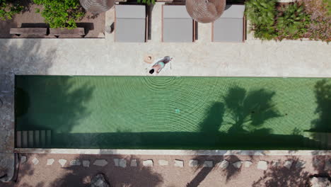 A-Woman-In-Bikini-Wear-By-The-Poolside-During-Photo-Shoot-In-Summertime