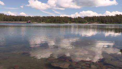 lake with reflecting clouds in finland