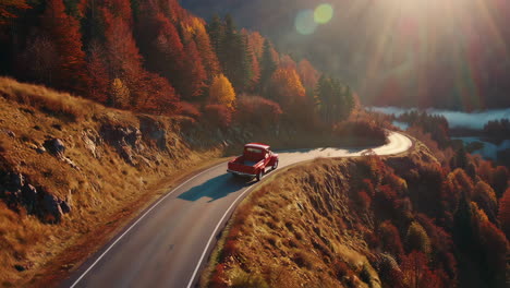 vintage truck on a scenic mountain road in autumn