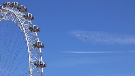 ferris wheel with airplane in clear sky