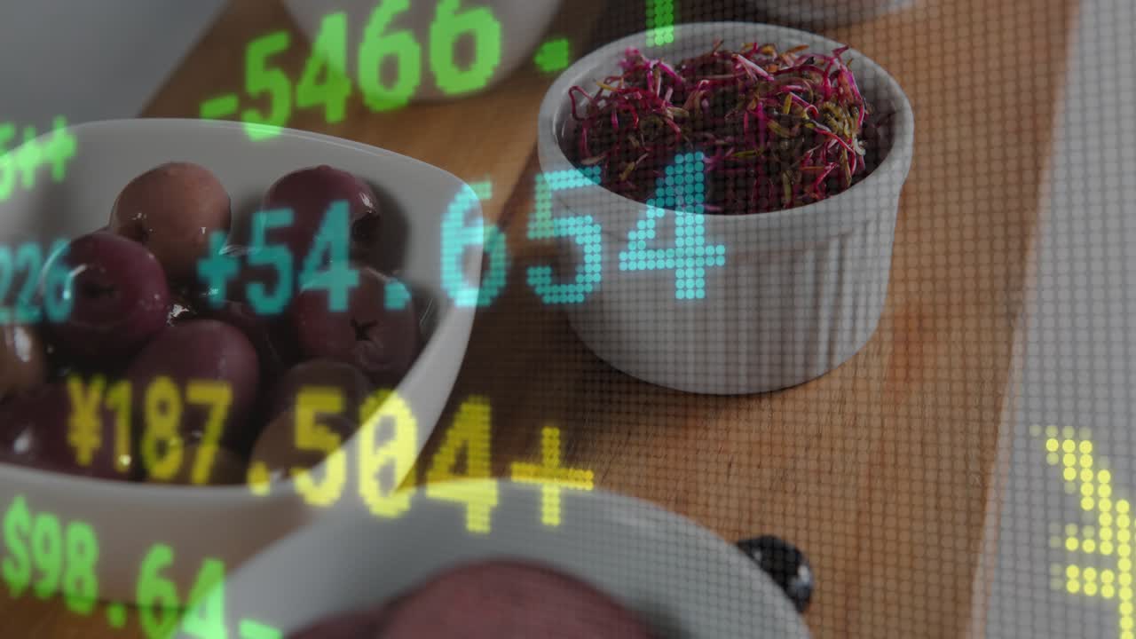 On market update, ticker overlay scrolling over white bowls on board, displaying currency changes