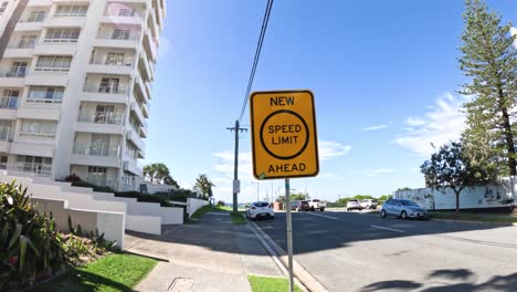 New speed limit sign near residential building