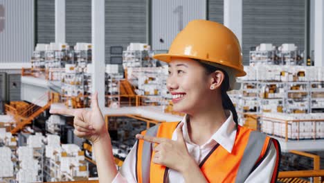 warehouse worker pointing to new product area