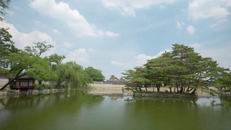 green pond around gyeonghoeru pavilion at gyeongbokgung palace on summer day