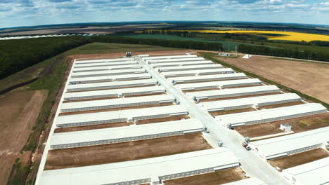 innovative complex among nature. white roofs of a modern production plant on the field. exterior of manufacturing. aerial view.