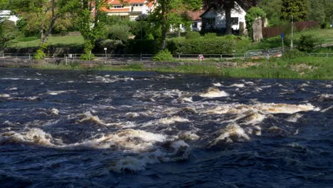 Water Flowing Over Rapids At The River Atran In Falkenberg, Famous for Fishing In Sweden