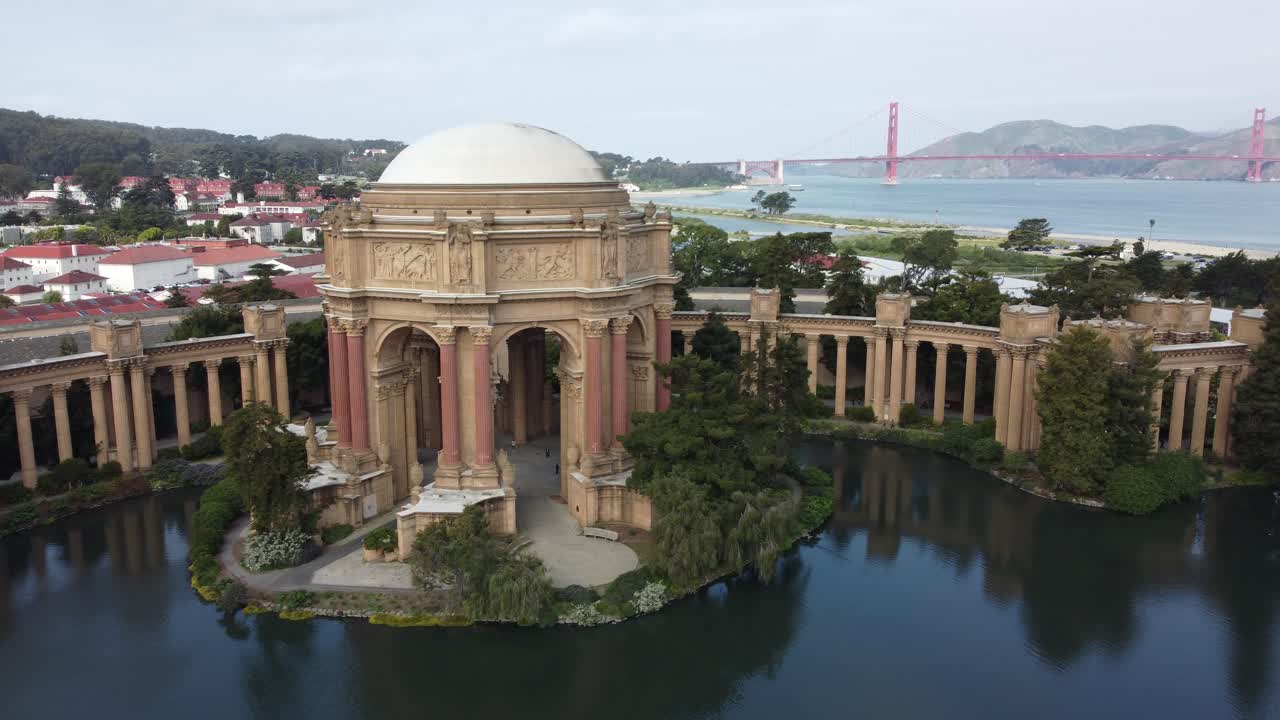 Palace Of Fine Arts At The Presidio In San Francisco, California (USA). Slow Aerial Pan Over Historic Landmark Buildings, Monuments, And Scenic Views Of Golden Gate Bridge Over The Bay.