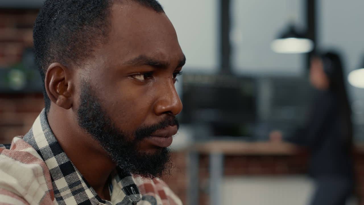 Closeup portrait of african american software developer working focused