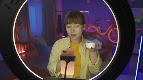 beauty influencer demonstrating skincare product