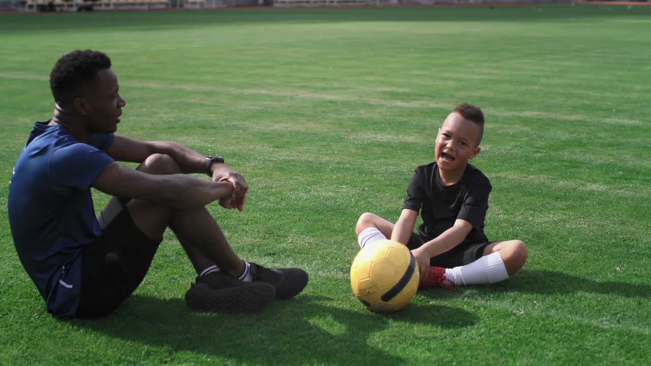 Father and son at the sports field