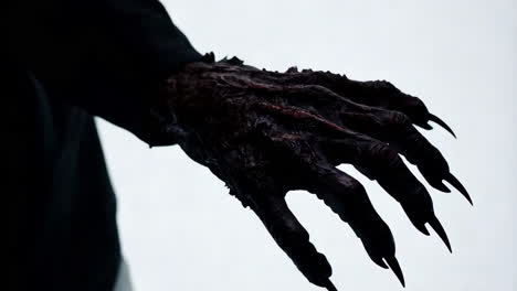 a monstrous hand reaching out