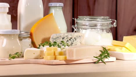 various dairy items displayed on a wooden surface