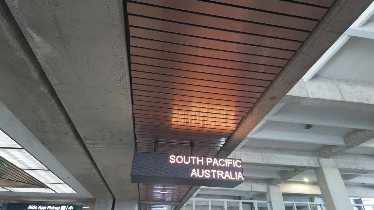 Airport stop sign for New Zealand and Neighbor Island at Honolulu Airport on Oahu, Hawaii. Highlights the station's modern architectural details and illuminated signage