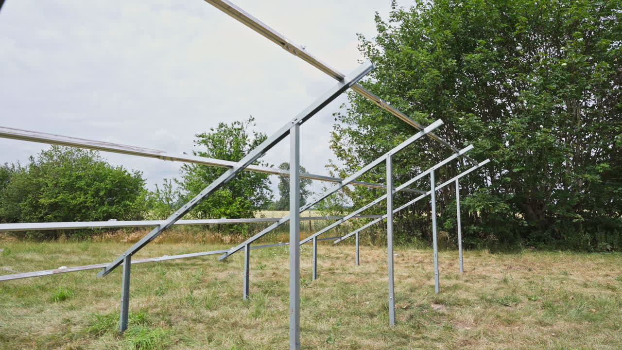 A View Of Ground-Mounted Photovoltaic System Solar Panel Frames. Low Angle Shot