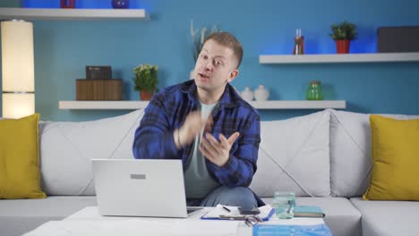 Home-office-worker-man-looking-at-camera-with-a-stern-angry-warning.