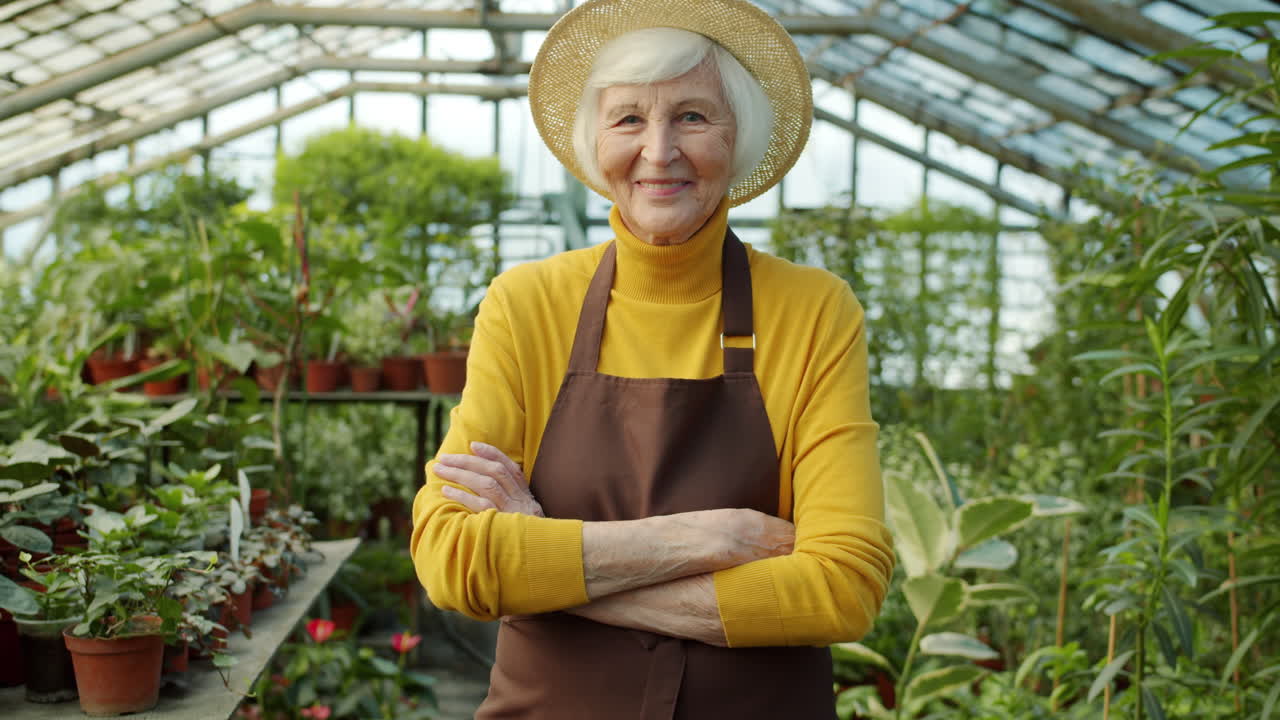 Senior Woman Gardener in Greenhouse