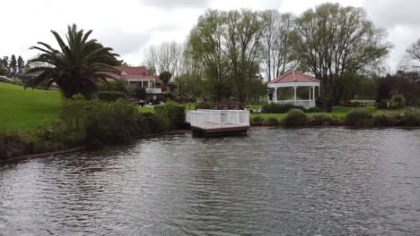 drone fly from the lake to the wedding venue outdoor settup florist working